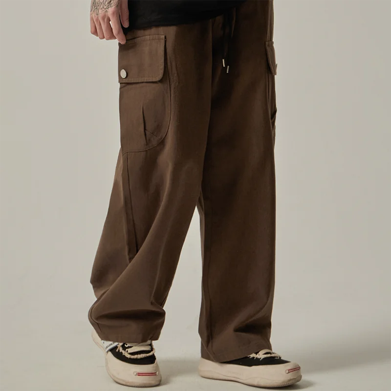 Pantalones cargo para hombre (primavera/otoño 2025): estilo vintage japonés, corte recto y holgado de pernera ancha, con botones, bolsillos grandes y cintura con cordón.