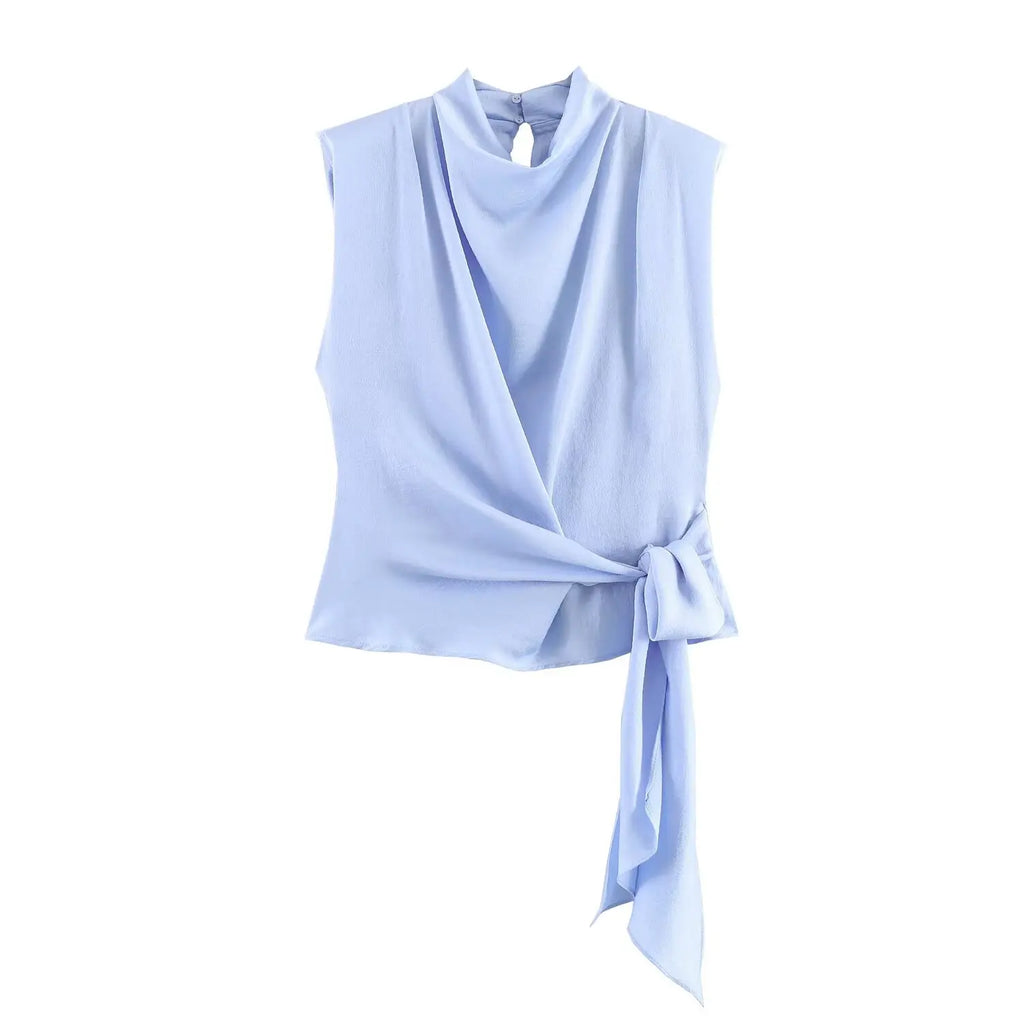 Women's top, Spring 2026 novelty: orange sleeveless design with satin texture and long tie; an elegant, stylish, and unique garment that sets the trend.