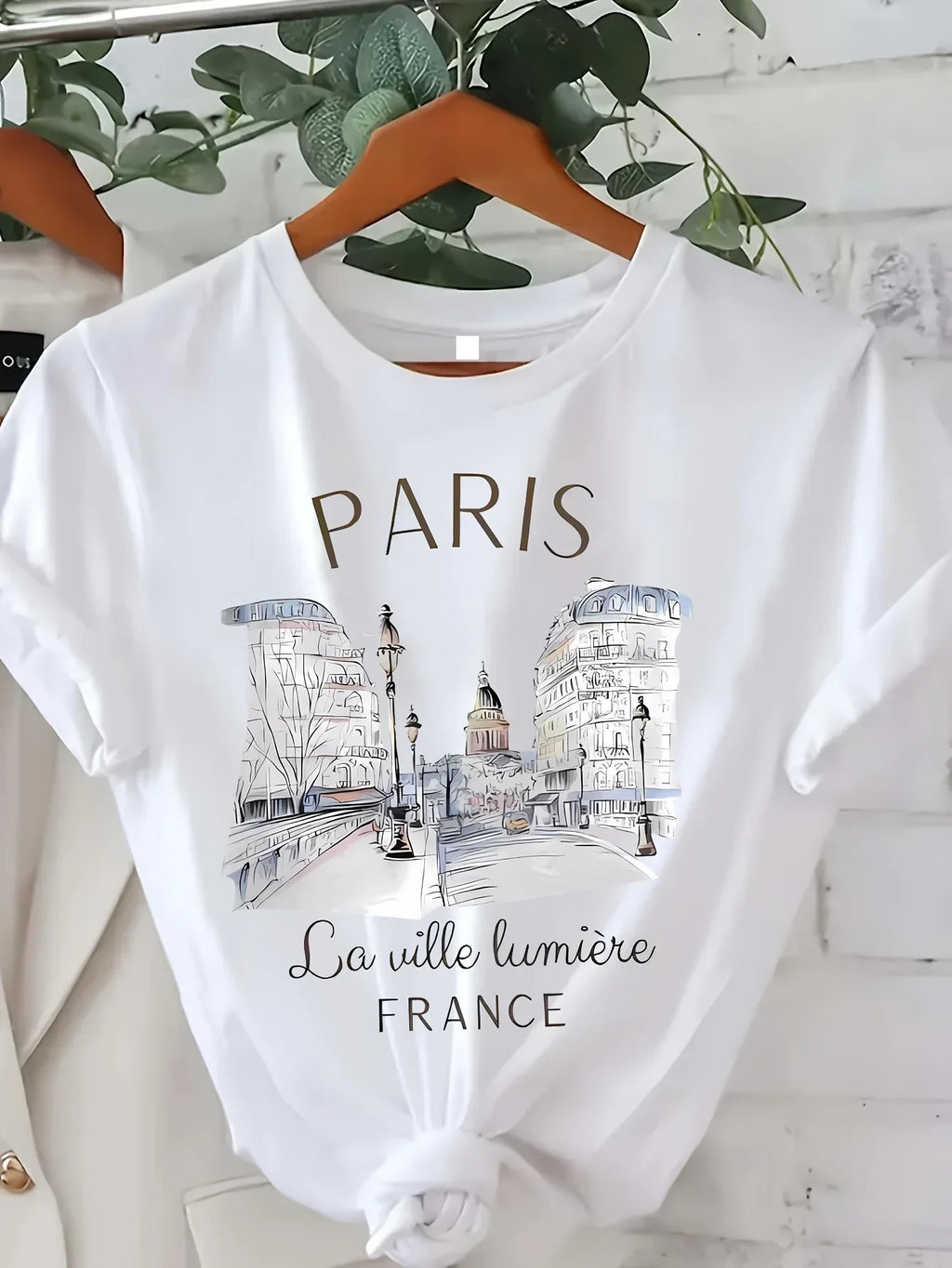 Y2K-style Paris-print t-shirt for women and girls; short sleeves, crew neck, casual garment ideal for spring and summer.